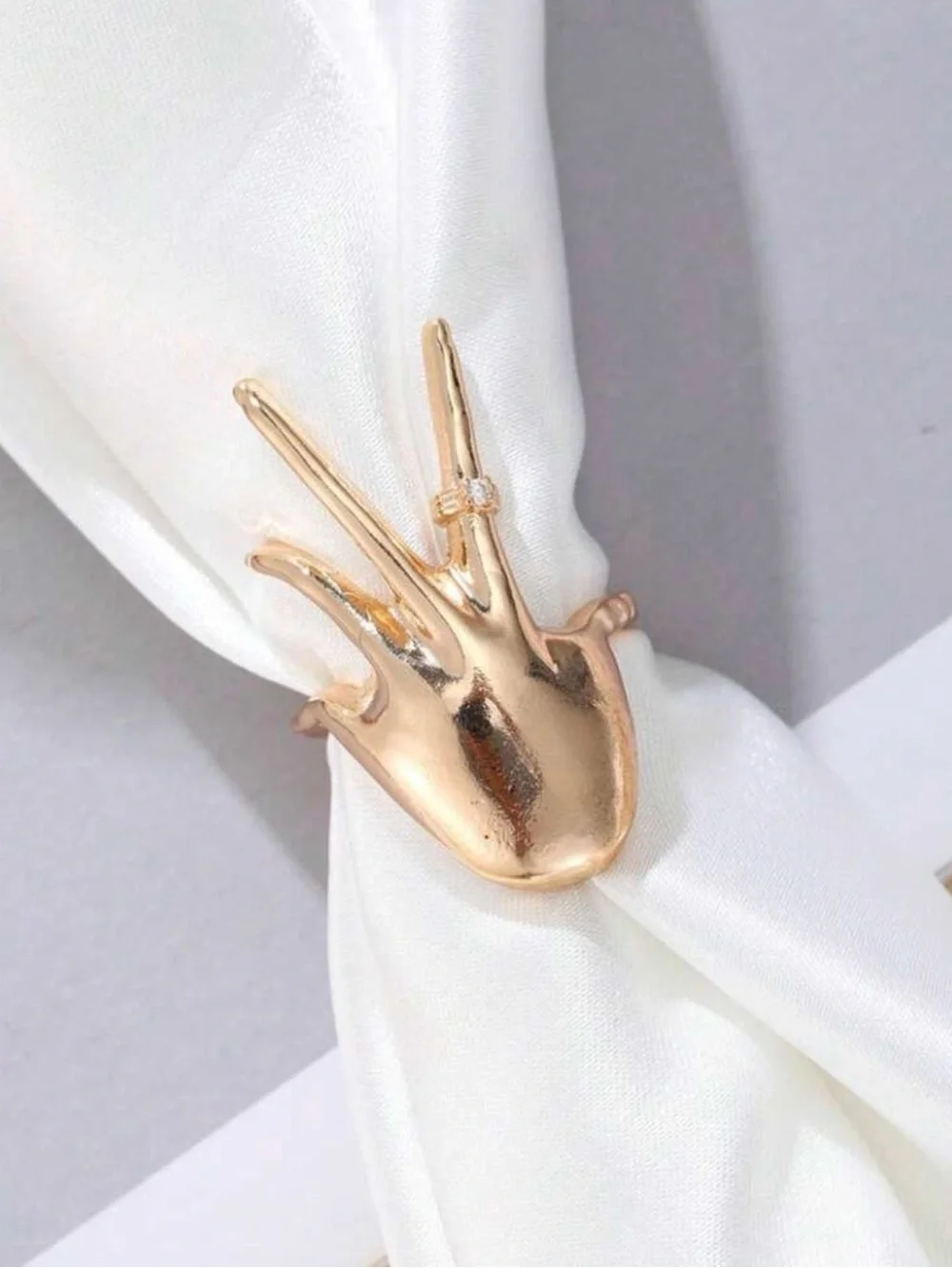 Gold Hand-Shaped Ring with Clear Stone